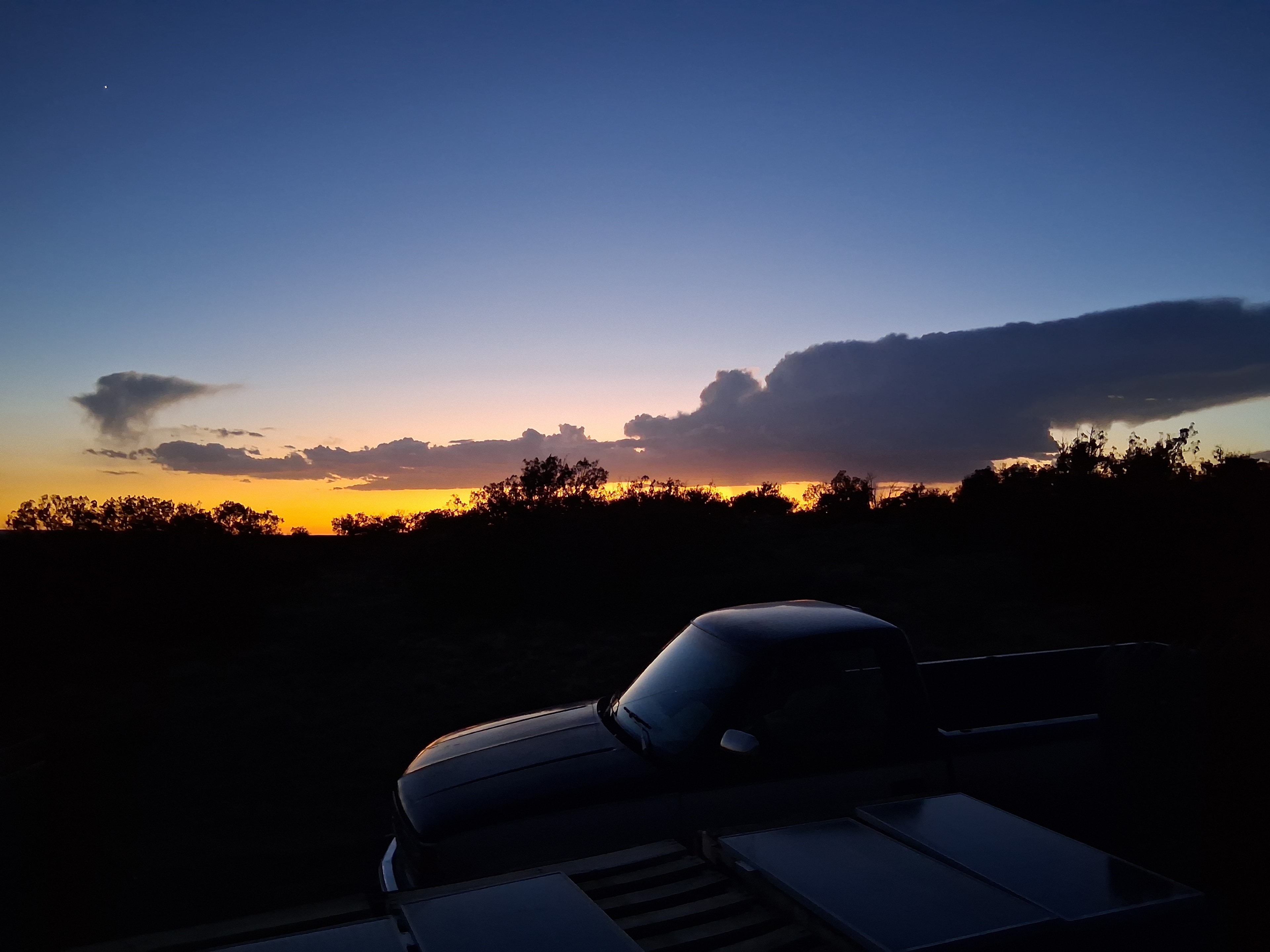 Sunset over the high desert landscape of Concho, Arizona — the town that inspired the name Concho Customs